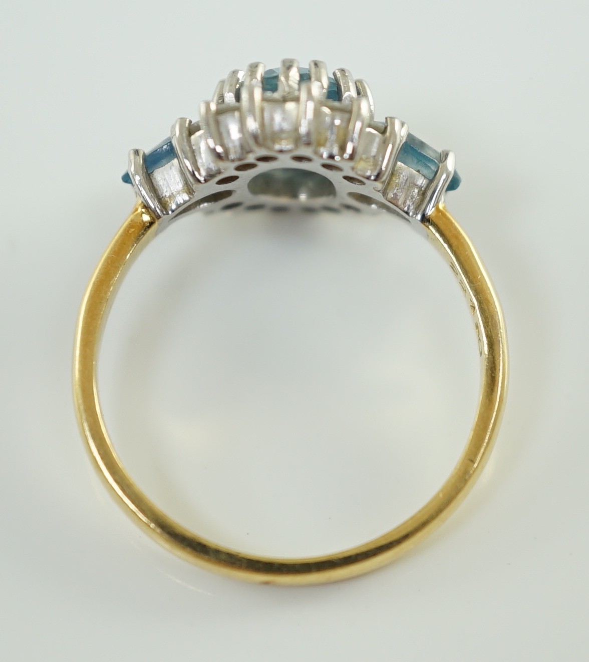 A 1970's 18ct gold, aquamarine and diamond set oval cluster ring, by Cropp & Farr